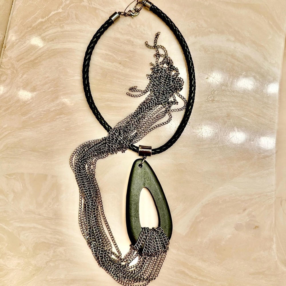 Free people necklace made of wood metal and learher. on sale get 50-60% off.